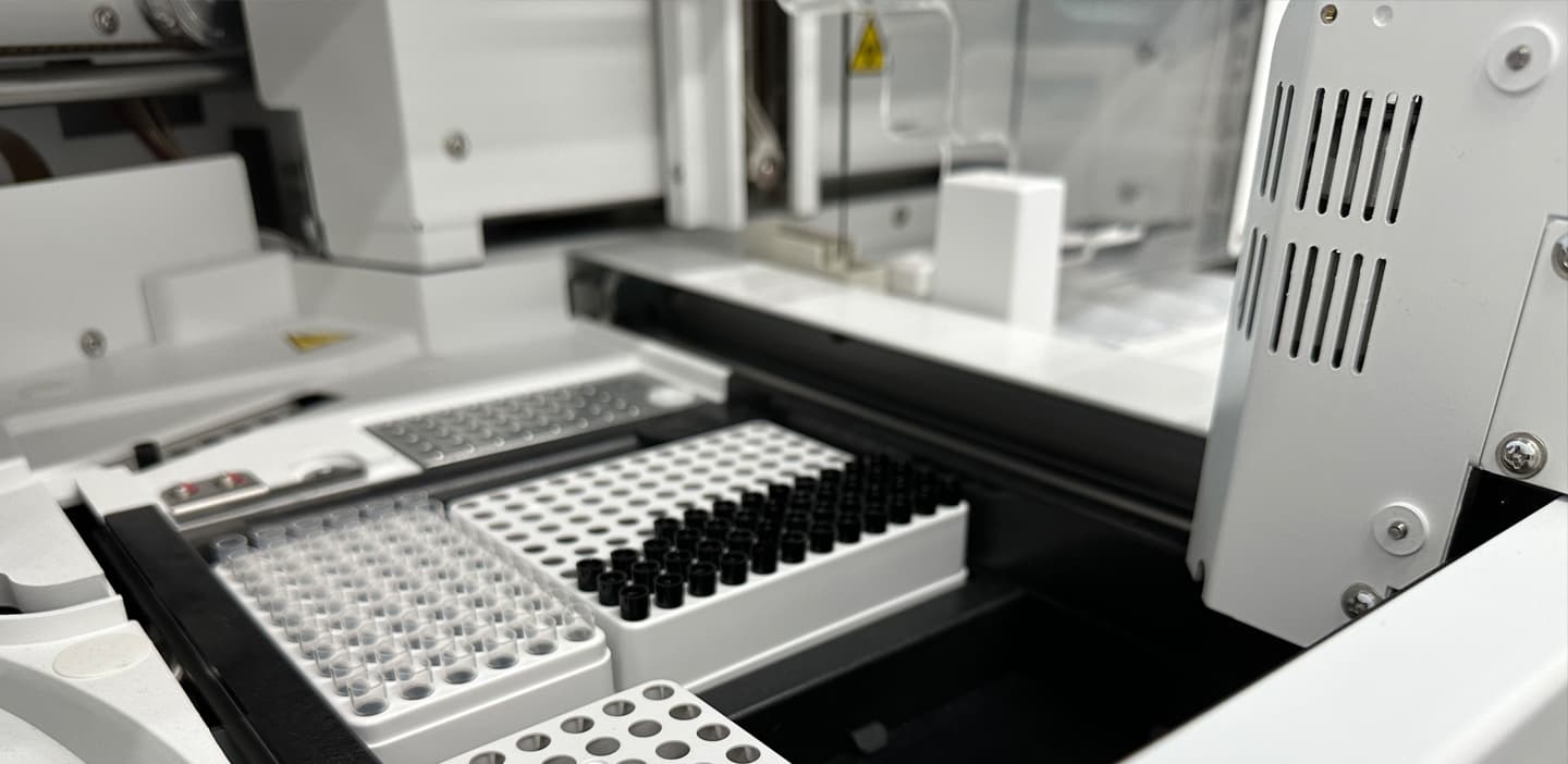 Sample tube racks staged for automated processing