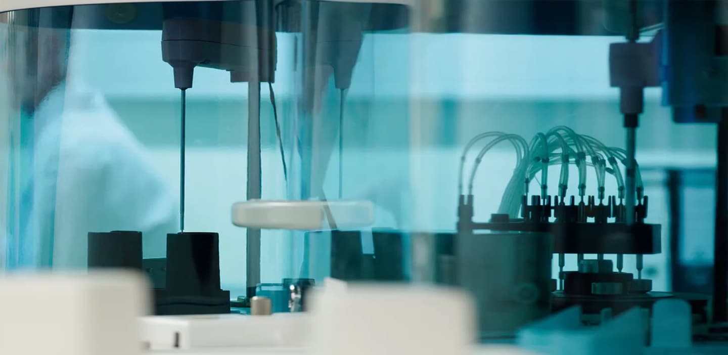 Lab technician operating an analyzer in our Glendale facility